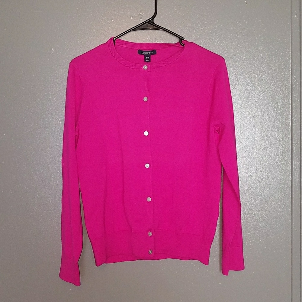 Pink button-up sweater.